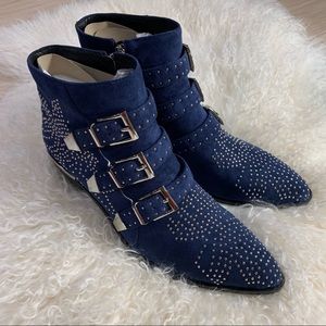 Blue suede studded boots.